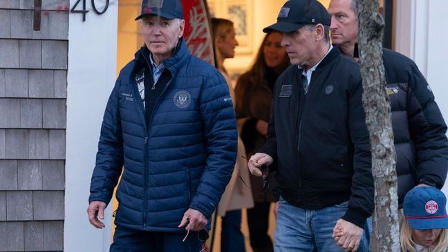 President Joe Biden and son Hunter Biden walk in downtown Nantucket Mass., Friday, Nov. 29, 2024. (AP Photo/Jose Luis Magana)
