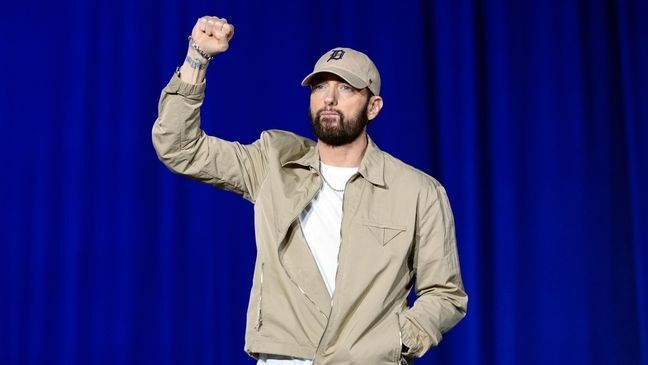 Rapper Eminem arrives to speak before former President Barack Obama at a campaign rally supporting Democratic presidential nominee Vice President Kamala Harris, Tuesday, Oct. 22, 2024, in Detroit. (AP Photo/Paul Sancya)